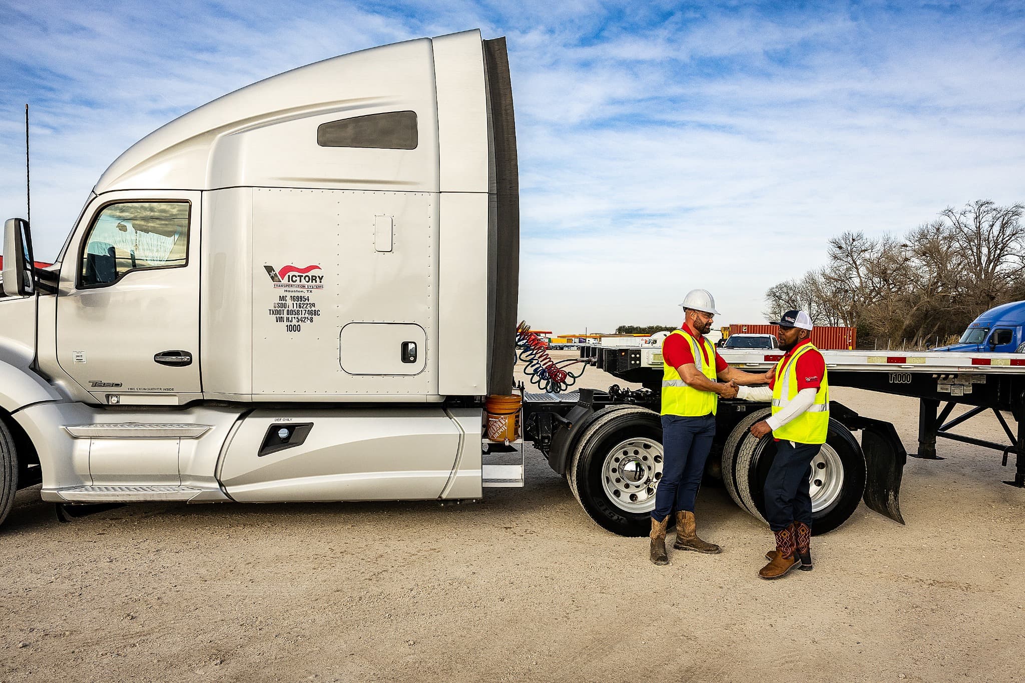 Hotshot transportation team reviewing equipment for a shipment