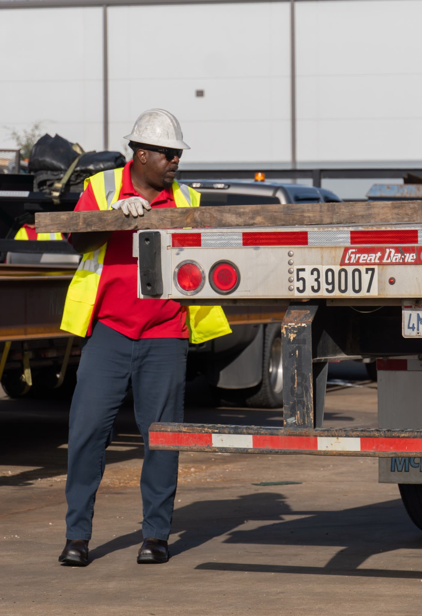 Victory owner operator securing freight on an open-deck trailer